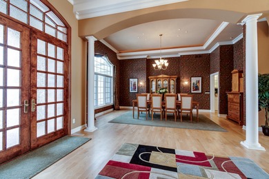 Situated along Hawk's Landing's premier fairway, this custom on Hawks Landing Golf Club in Wisconsin - for sale on GolfHomes.com, golf home, golf lot