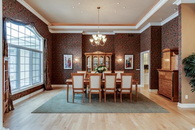 Situated along Hawk's Landing's premier fairway, this custom on Hawks Landing Golf Club in Wisconsin - for sale on GolfHomes.com, golf home, golf lot