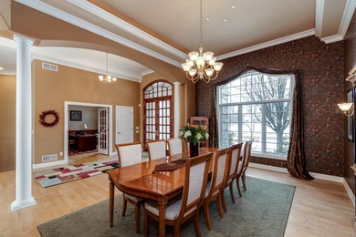 Situated along Hawk's Landing's premier fairway, this custom on Hawks Landing Golf Club in Wisconsin - for sale on GolfHomes.com, golf home, golf lot