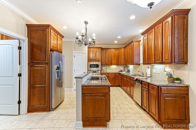 Gates Four - Welcome to this stunning 5-bedroom, 3.5-bath brick on Gates Four Golf and Country Club in North Carolina - for sale on GolfHomes.com, golf home, golf lot