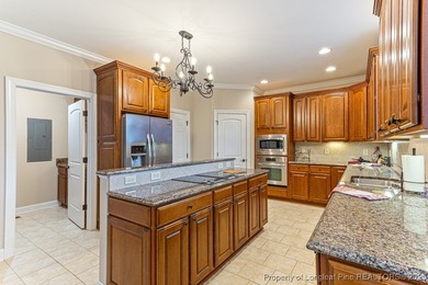 Gates Four - Welcome to this stunning 5-bedroom, 3.5-bath brick on Gates Four Golf and Country Club in North Carolina - for sale on GolfHomes.com, golf home, golf lot