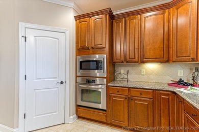 Gates Four - Welcome to this stunning 5-bedroom, 3.5-bath brick on Gates Four Golf and Country Club in North Carolina - for sale on GolfHomes.com, golf home, golf lot