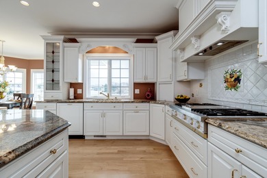 Situated along Hawk's Landing's premier fairway, this custom on Hawks Landing Golf Club in Wisconsin - for sale on GolfHomes.com, golf home, golf lot