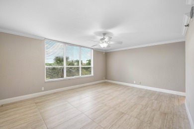 Discover this stunning condo with breathtaking lake and golf on Boca Pointe Country Club in Florida - for sale on GolfHomes.com, golf home, golf lot