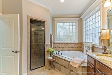 Gates Four - Welcome to this stunning 5-bedroom, 3.5-bath brick on Gates Four Golf and Country Club in North Carolina - for sale on GolfHomes.com, golf home, golf lot