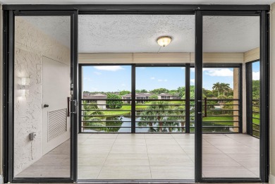 Discover this stunning condo with breathtaking lake and golf on Boca Pointe Country Club in Florida - for sale on GolfHomes.com, golf home, golf lot