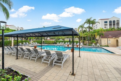Discover this stunning condo with breathtaking lake and golf on Boca Pointe Country Club in Florida - for sale on GolfHomes.com, golf home, golf lot