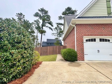 Gates Four - Welcome to this stunning 5-bedroom, 3.5-bath brick on Gates Four Golf and Country Club in North Carolina - for sale on GolfHomes.com, golf home, golf lot