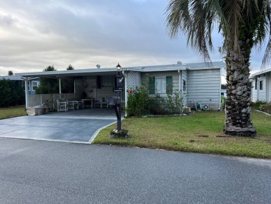 2 bed | 2 bath | 1248 sq ft | Lot 209 | $49,900    She's got on Lake Henry Golf Club in Florida - for sale on GolfHomes.com, golf home, golf lot