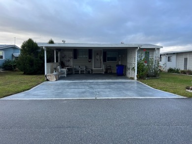 2 bed | 2 bath | 1248 sq ft | Lot 209 | $49,900    She's got on Lake Henry Golf Club in Florida - for sale on GolfHomes.com, golf home, golf lot