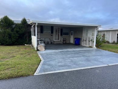 2 bed | 2 bath | 1248 sq ft | Lot 209 | $49,900    She's got on Lake Henry Golf Club in Florida - for sale on GolfHomes.com, golf home, golf lot