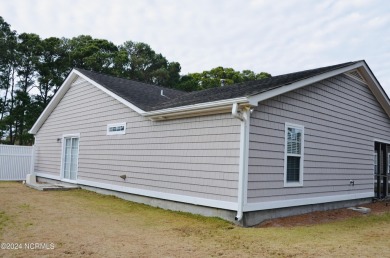 This cute home is located just over the bridge from Oak Island on South Harbour Golf Links in North Carolina - for sale on GolfHomes.com, golf home, golf lot