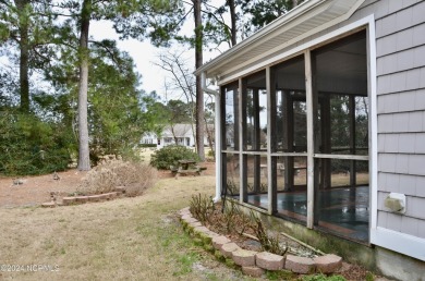 This cute home is located just over the bridge from Oak Island on South Harbour Golf Links in North Carolina - for sale on GolfHomes.com, golf home, golf lot