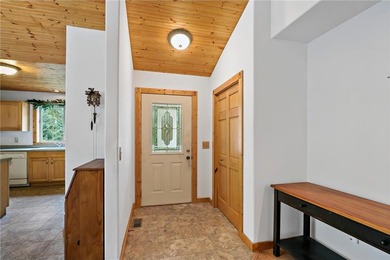 Enjoy easy one-level living on over 1.5 beautifully treed acres on Deacons Lodge Golf Course in Minnesota - for sale on GolfHomes.com, golf home, golf lot