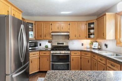 Don't miss this spacious and METICULOUSLY cared for home located on Maple Hill Golf Course in Michigan - for sale on GolfHomes.com, golf home, golf lot