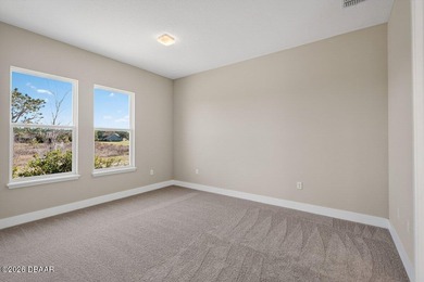 Welcome to The Lydia, a CFB Award-winning home that blends on LPGA International Golf Course in Florida - for sale on GolfHomes.com, golf home, golf lot