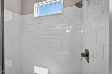 Welcome to The Lydia, a CFB Award-winning home that blends on LPGA International Golf Course in Florida - for sale on GolfHomes.com, golf home, golf lot