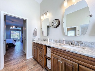 Nestled within the highly sought-after gated community of on East Lake Woodlands Country Club in Florida - for sale on GolfHomes.com, golf home, golf lot