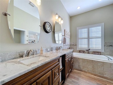 Nestled within the highly sought-after gated community of on East Lake Woodlands Country Club in Florida - for sale on GolfHomes.com, golf home, golf lot