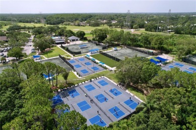 Nestled within the highly sought-after gated community of on East Lake Woodlands Country Club in Florida - for sale on GolfHomes.com, golf home, golf lot
