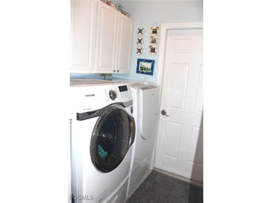 Discover unparalleled Florida living in this beautifully on Herons Glen Golf and Country Club in Florida - for sale on GolfHomes.com, golf home, golf lot