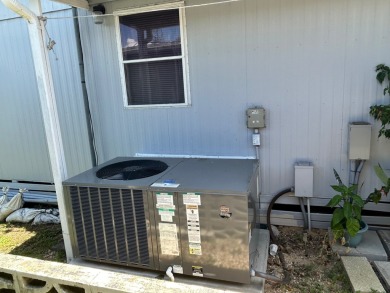 Free boat dock with access to the Dora Canal. The sunroom offers on Bay Tree Golf Course in Florida - for sale on GolfHomes.com, golf home, golf lot