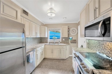 Escape to your secluded South Tampa sanctuary, where mornings on Palma Ceia Golf and Country Club in Florida - for sale on GolfHomes.com, golf home, golf lot