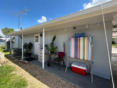 Free boat dock with access to the Dora Canal. The sunroom offers on Bay Tree Golf Course in Florida - for sale on GolfHomes.com, golf home, golf lot