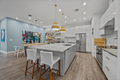 A house with modern finishes and amazing vintage decor combines on Palm Beach Polo and Country Club in Florida - for sale on GolfHomes.com, golf home, golf lot