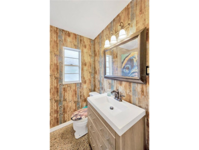 Escape to your secluded South Tampa sanctuary, where mornings on Palma Ceia Golf and Country Club in Florida - for sale on GolfHomes.com, golf home, golf lot