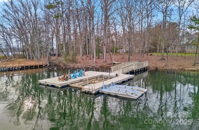 Embrace lake life at its finest in this truly exceptional on Old North State Club at Uwharrie Point Golf community in North Carolina - for sale on GolfHomes.com, golf home, golf lot