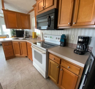 Immaculate newly updated Champion park model is ready for next on Clerbrook Resort, Inc. in Florida - for sale on GolfHomes.com, golf home, golf lot