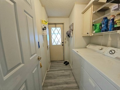 Discover Florida Living in this 1989, 2-bed/2-bath home located on The Club At Pointe West in Florida - for sale on GolfHomes.com, golf home, golf lot