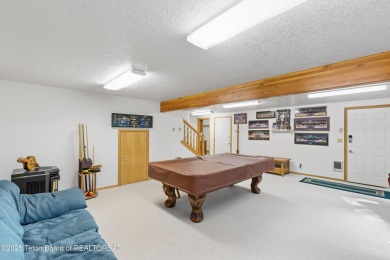 Surrounded by towering evergreens and endless mountain views on Star Valley RV Golf Course in Wyoming - for sale on GolfHomes.com, golf home, golf lot