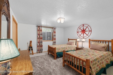 Surrounded by towering evergreens and endless mountain views on Star Valley RV Golf Course in Wyoming - for sale on GolfHomes.com, golf home, golf lot