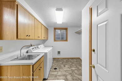 Surrounded by towering evergreens and endless mountain views on Star Valley RV Golf Course in Wyoming - for sale on GolfHomes.com, golf home, golf lot