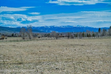 Take in breathtaking sunsets over the Bighole Mountains from on Targhee Village Golf Course in Wyoming - for sale on GolfHomes.com, golf home, golf lot