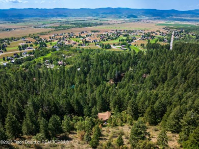 Surrounded by towering evergreens and endless mountain views on Star Valley RV Golf Course in Wyoming - for sale on GolfHomes.com, golf home, golf lot
