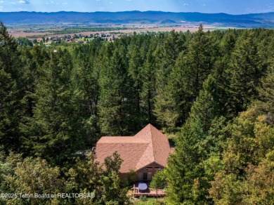 Surrounded by towering evergreens and endless mountain views on Star Valley RV Golf Course in Wyoming - for sale on GolfHomes.com, golf home, golf lot