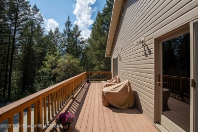 Surrounded by towering evergreens and endless mountain views on Star Valley RV Golf Course in Wyoming - for sale on GolfHomes.com, golf home, golf lot