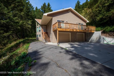 Surrounded by towering evergreens and endless mountain views on Star Valley RV Golf Course in Wyoming - for sale on GolfHomes.com, golf home, golf lot