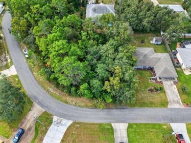 BUILD YOUR DREAM HOME on this spacious 0.40-acre CORNER lot on Oak Hills Country Club in Florida - for sale on GolfHomes.com, golf home, golf lot