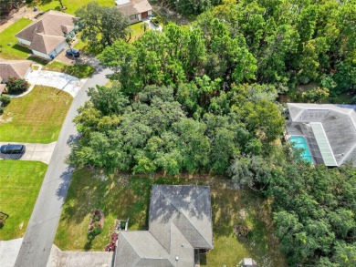 BUILD YOUR DREAM HOME on this spacious 0.40-acre CORNER lot on Oak Hills Country Club in Florida - for sale on GolfHomes.com, golf home, golf lot
