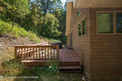 Surrounded by towering evergreens and endless mountain views on Star Valley RV Golf Course in Wyoming - for sale on GolfHomes.com, golf home, golf lot