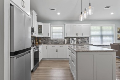 Nestled in a quiet cul-de-sac in Myrtle Beach Golf and Yacht on Heron Point Golf Club in South Carolina - for sale on GolfHomes.com, golf home, golf lot