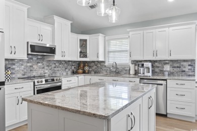 Nestled in a quiet cul-de-sac in Myrtle Beach Golf and Yacht on Heron Point Golf Club in South Carolina - for sale on GolfHomes.com, golf home, golf lot