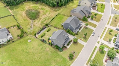 Nestled in the sought-after Legacy at Jordan Lake community on The Preserve At Jordan Lake Golf Club in North Carolina - for sale on GolfHomes.com, golf home, golf lot