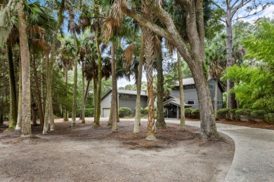 Nestled on a half-acre homesite beneath majestic oak trees on The Seabrook Island Club in South Carolina - for sale on GolfHomes.com, golf home, golf lot