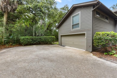 Nestled on a half-acre homesite beneath majestic oak trees on The Seabrook Island Club in South Carolina - for sale on GolfHomes.com, golf home, golf lot