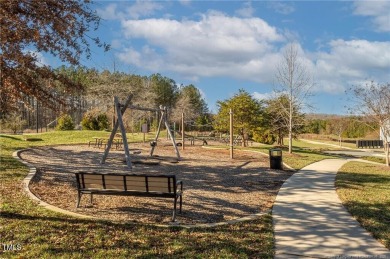 Nestled in the sought-after Legacy at Jordan Lake community on The Preserve At Jordan Lake Golf Club in North Carolina - for sale on GolfHomes.com, golf home, golf lot